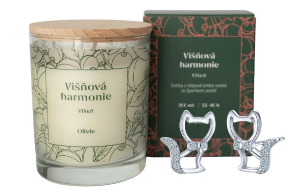 svíčka se stříbrným šperkem uvnitř